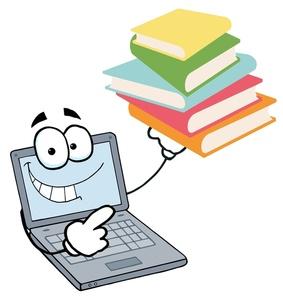 Laptop pointing to books