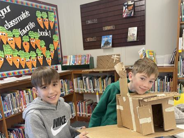 Students working on a project in library enrichment